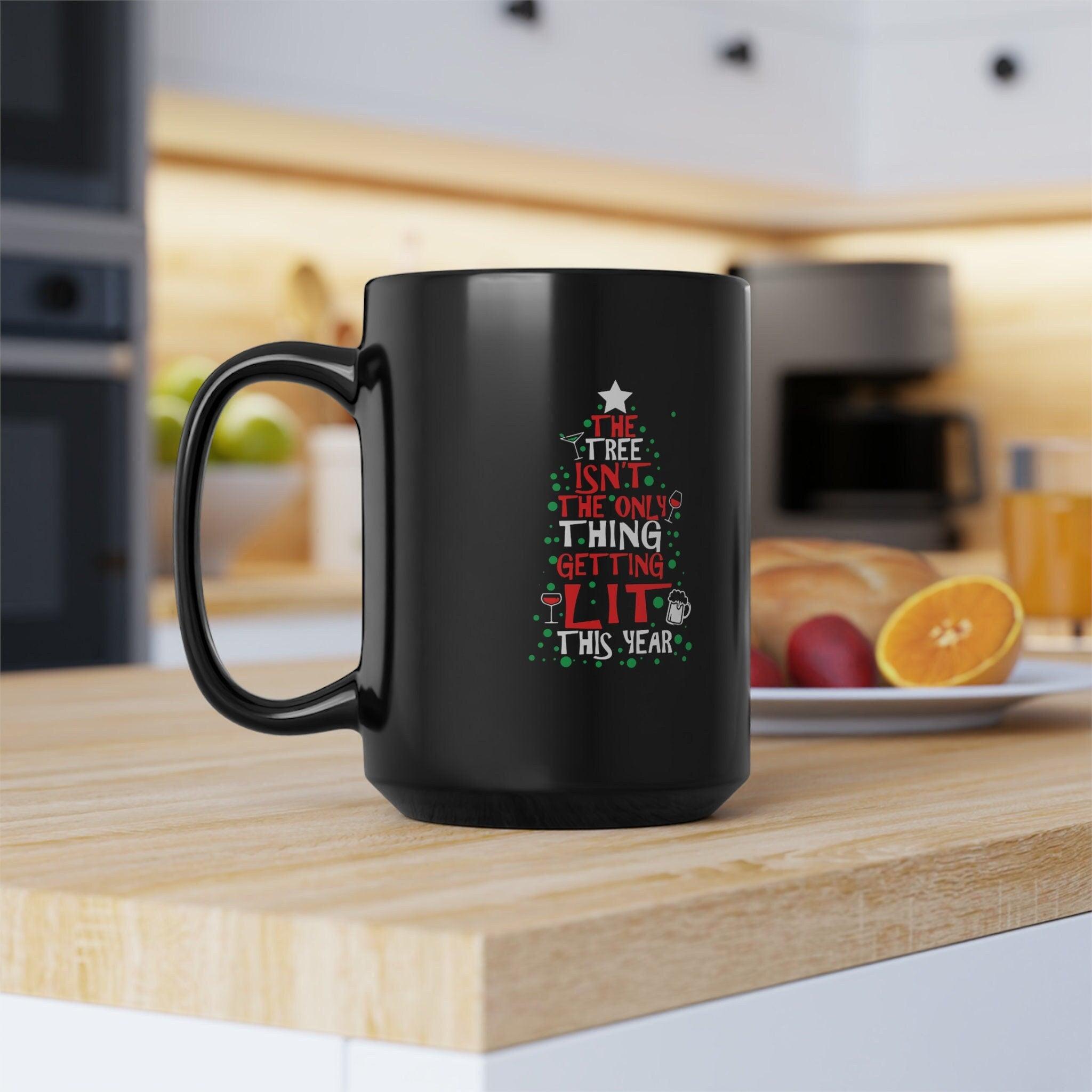 The Tree Isn&#39;t The Only Thing Getting Lit This Year Classic Black Mugs, Ceramic Coffee Mug, Christmas Coffee Mug, Christmas gift, Christmas gift idea, Christmas mug, Coffee mug, Custom mug, Decorative Mug, Enamel mug, Funny Xmas Mug, Gift for Christmas, Holiday gift, Personalized mug - plusminusco.com